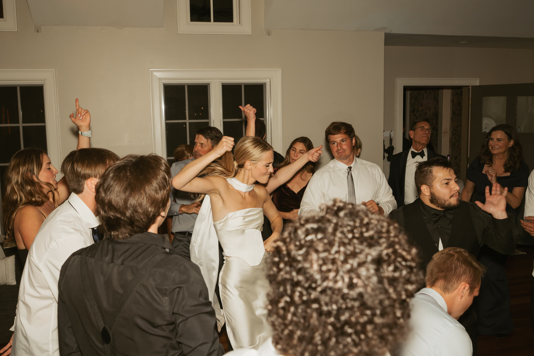 Bride dancing with guests at the reception