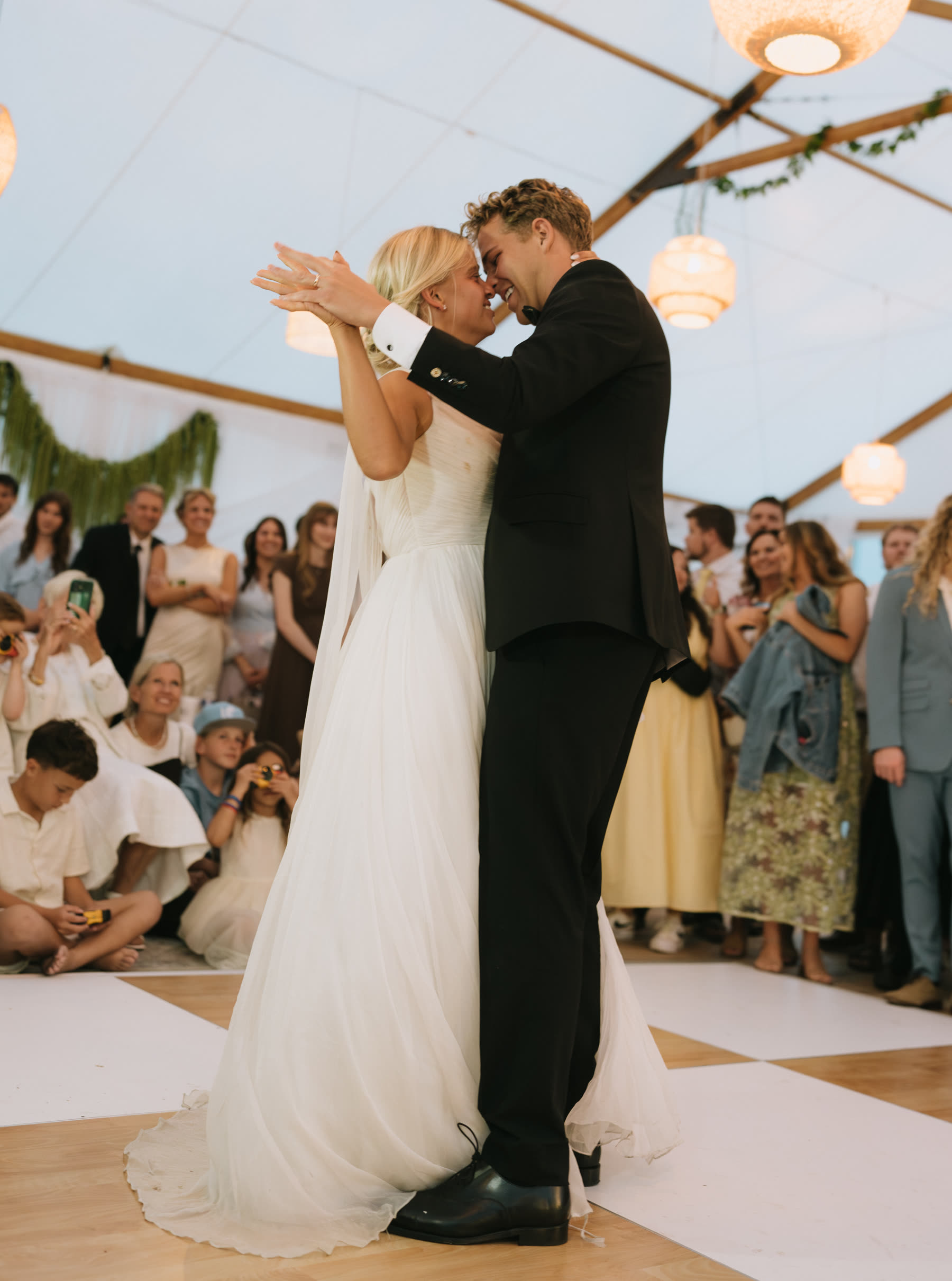 Bride and groom laughing at the reception