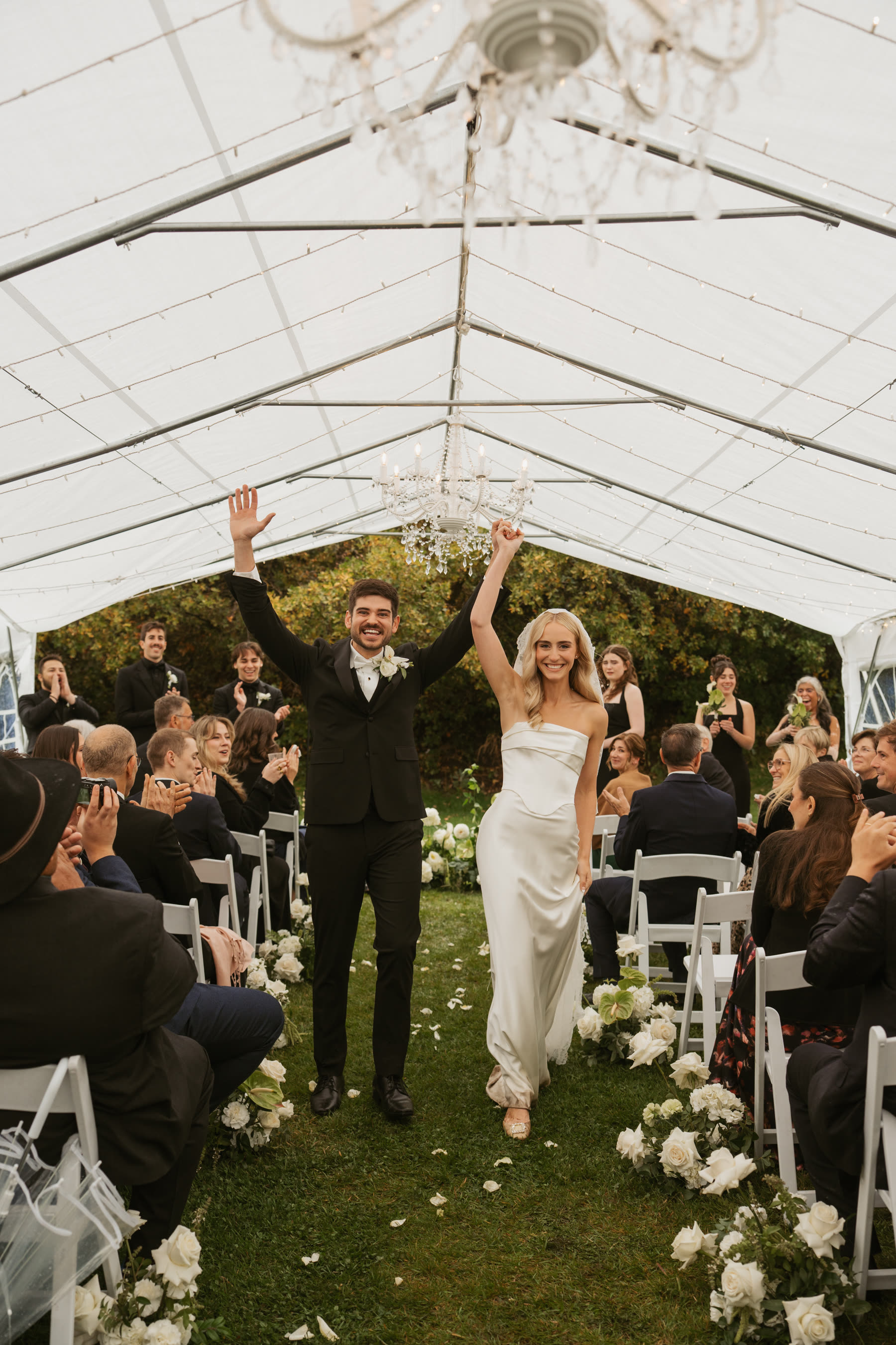 Bride and groom celebrating with guests