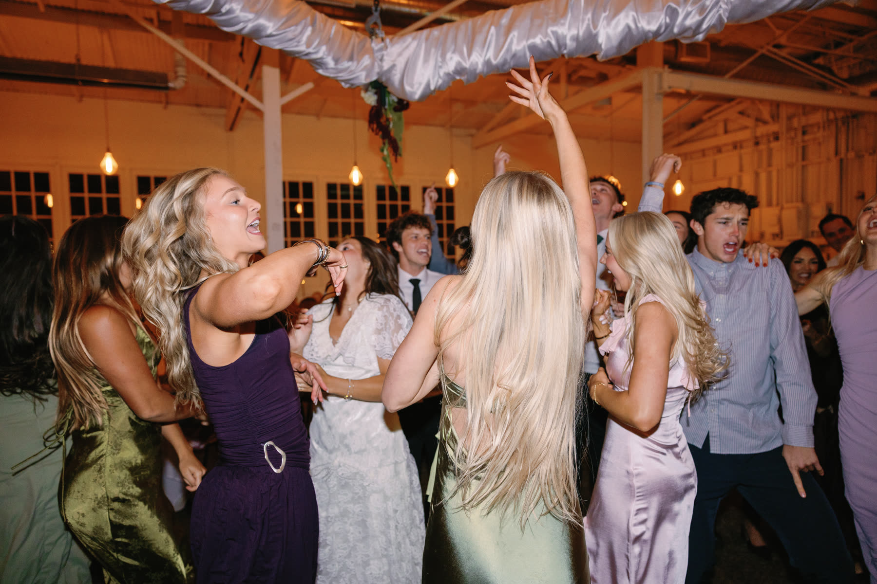 Guests dancing at the reception