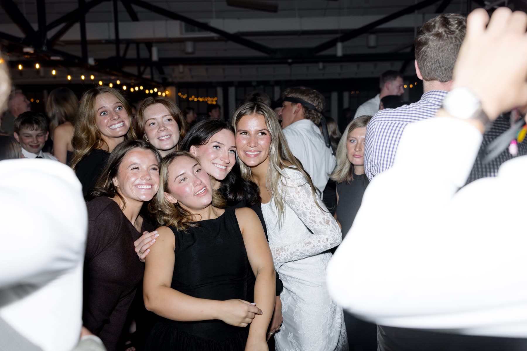 Guests dancing and laughing at the reception