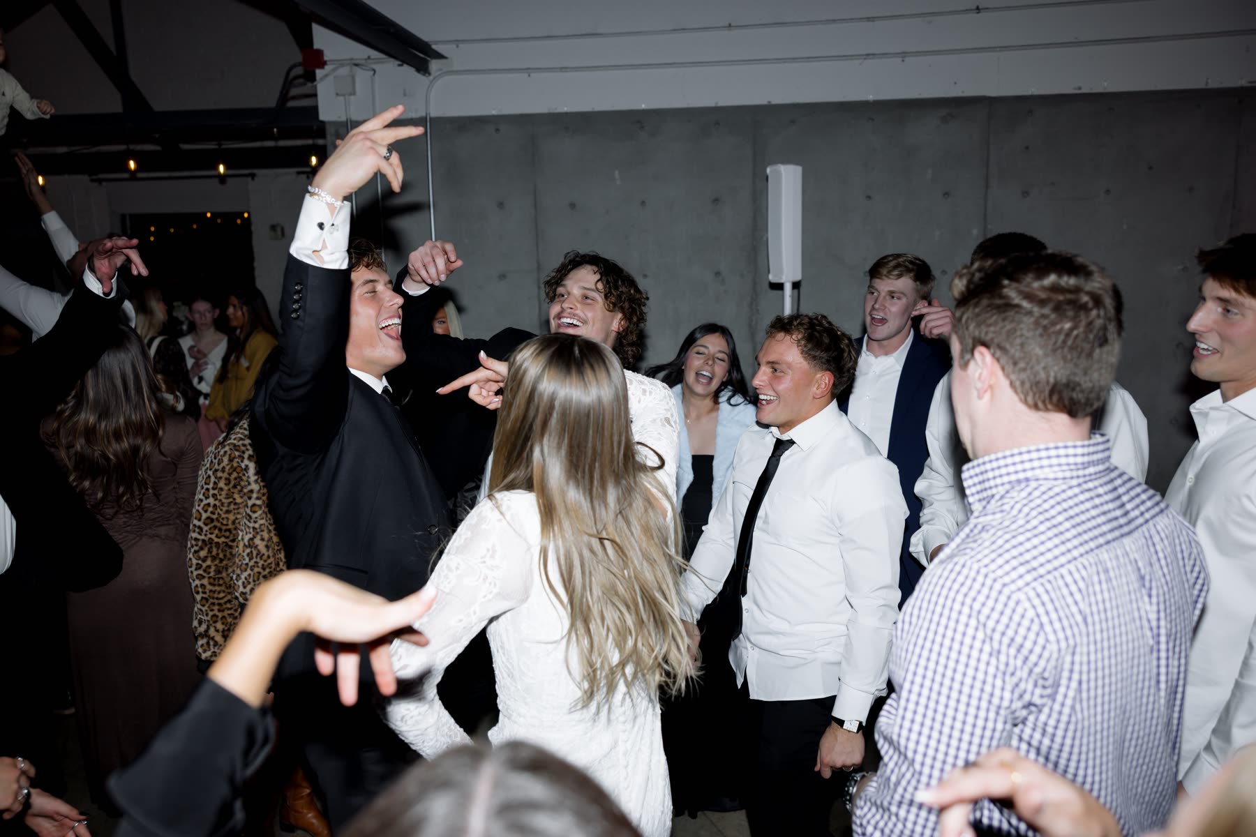Groomsmen celebrating on the dance floor