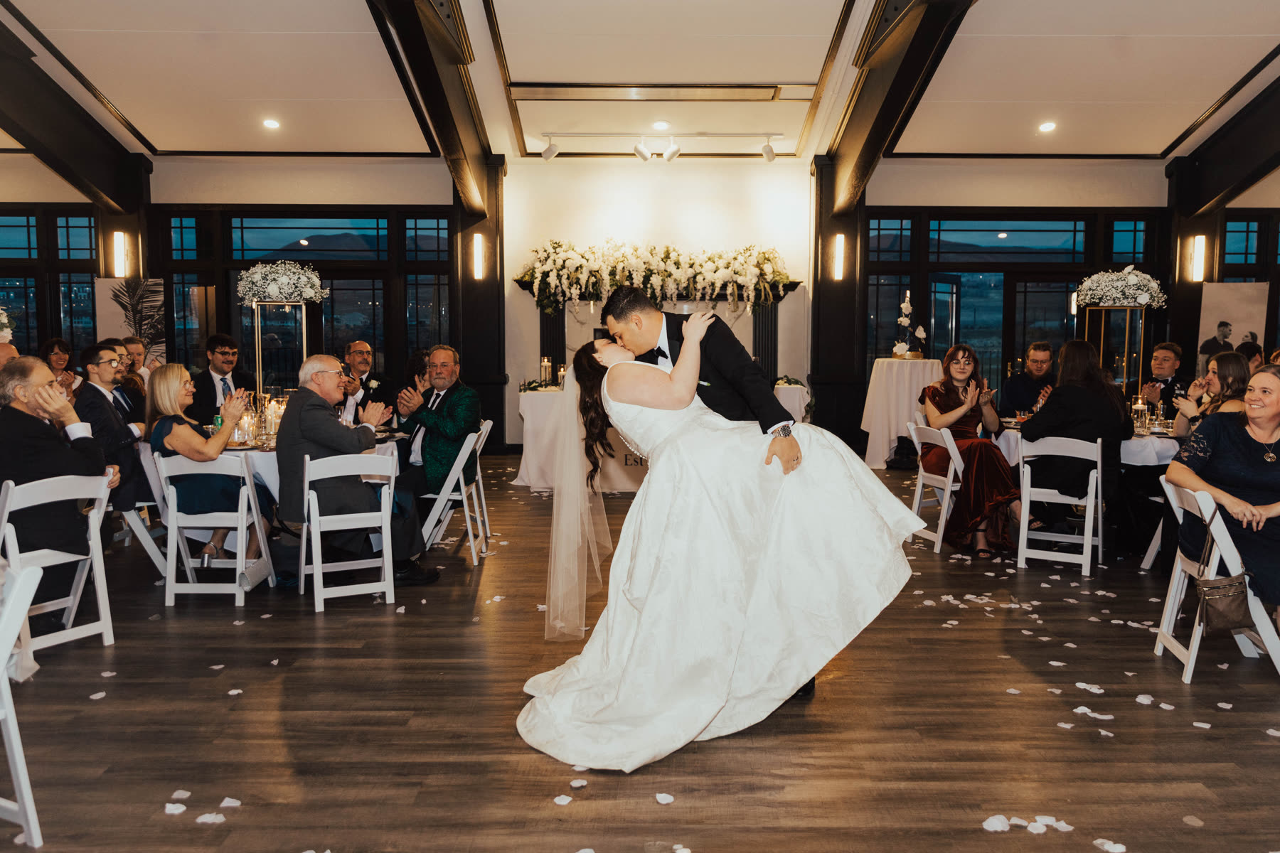 Bride and groom kissing at the reception