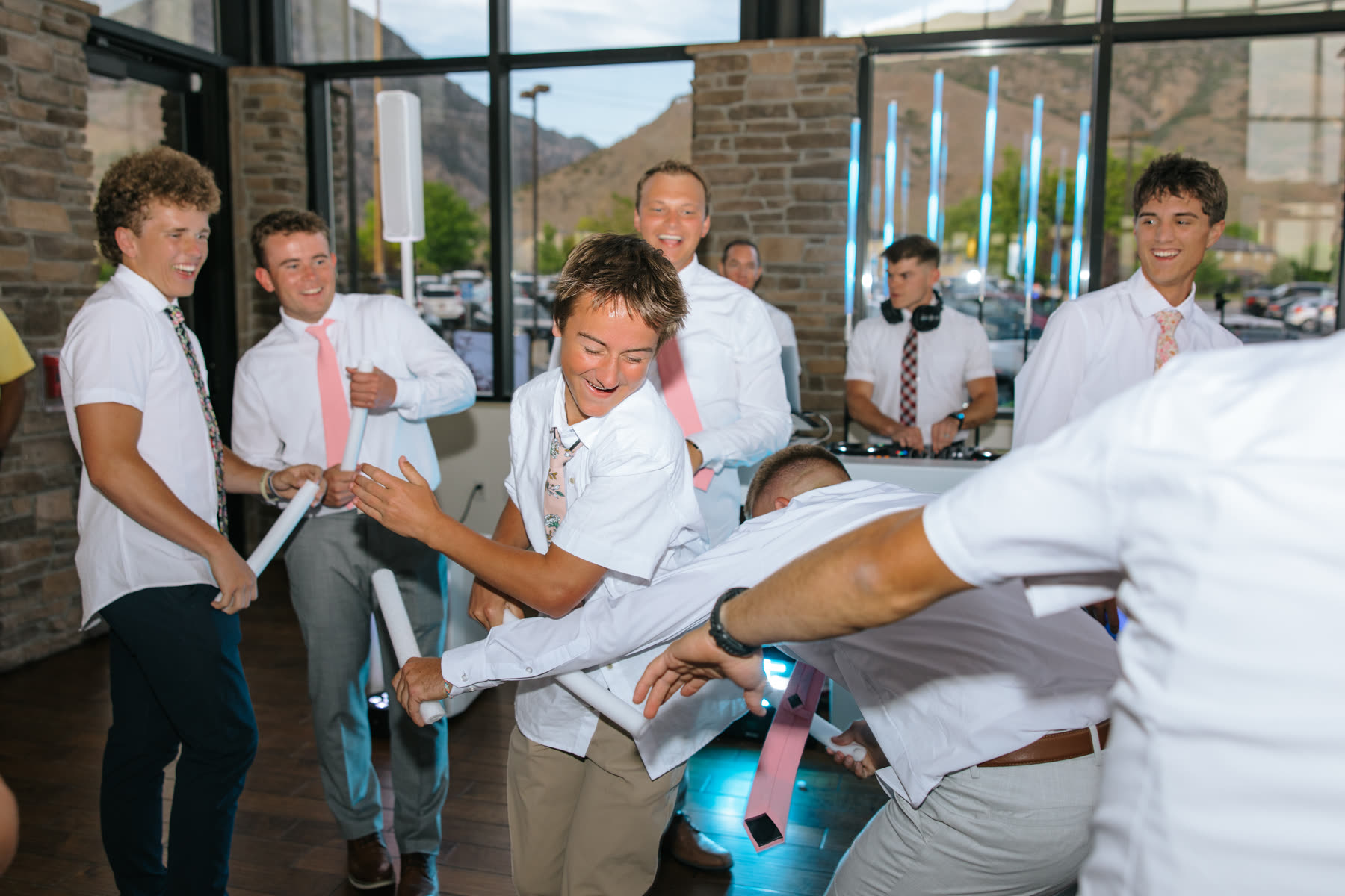Guests dancing with glow foam sticks